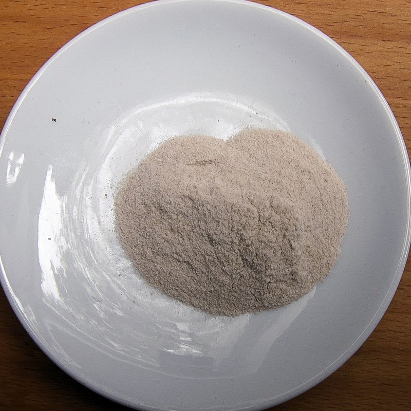 Powdered psyllium husk on a white plate